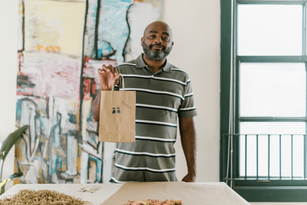 A man holding  a paperbag