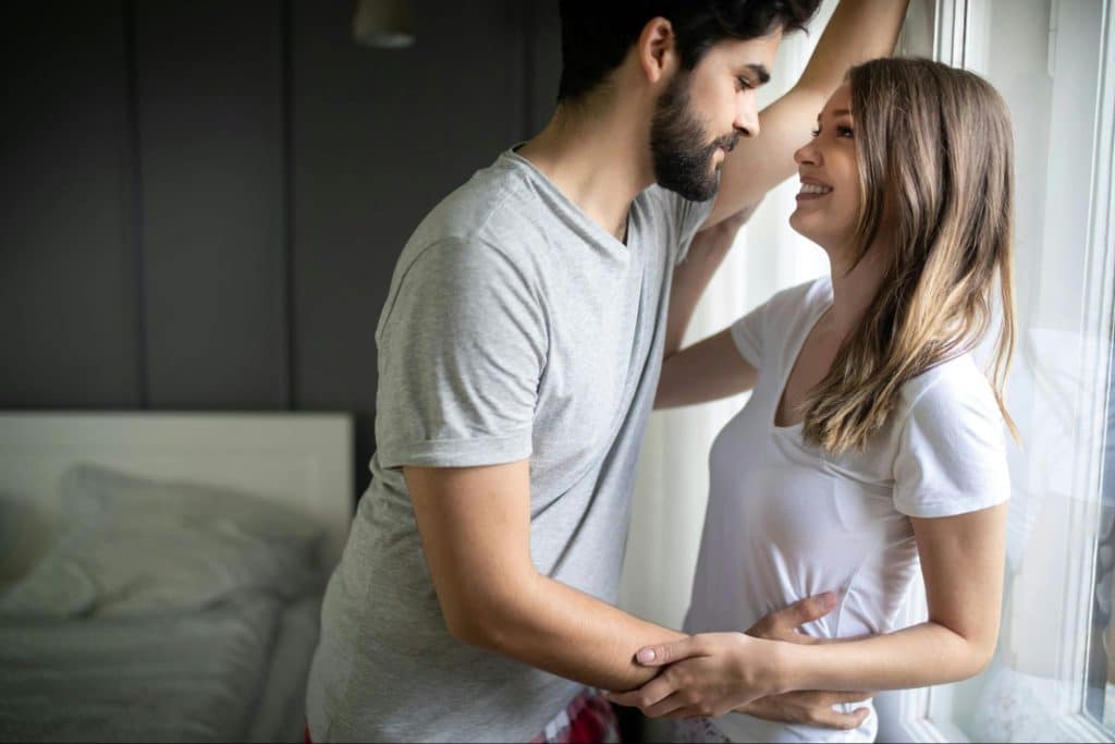 A man and woman facing each other