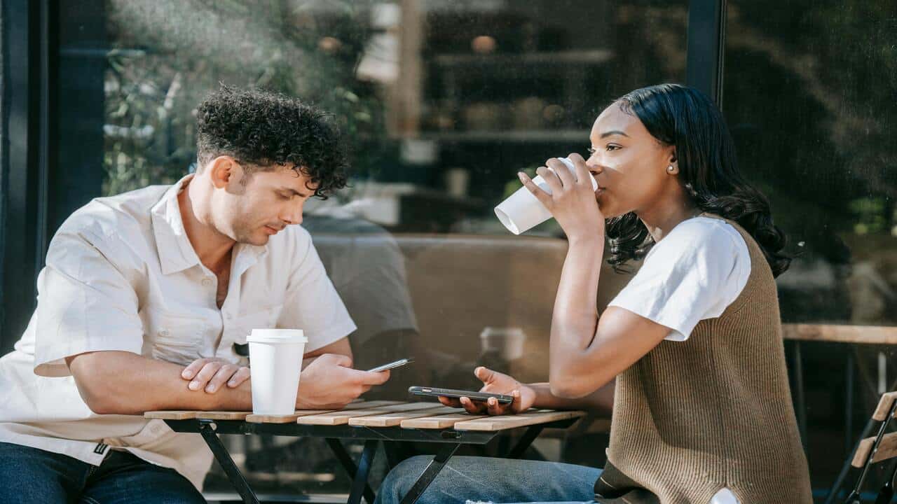 A couple looking serious during a coffee date