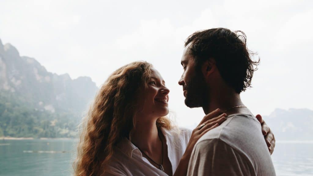 A beautiful couple having a romantic moment in a hilly area.