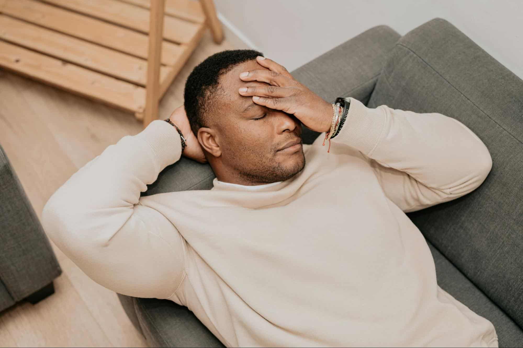 A man holding his head