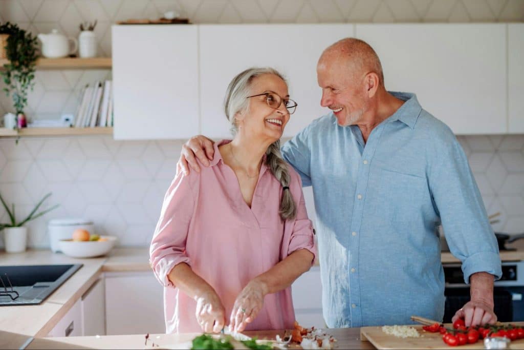 A man and woman at the kitchen
