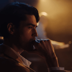 Side View of Man With His Hand on His Mouth