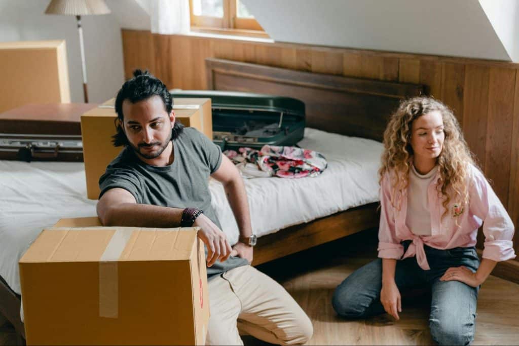 A man and woman sitting at the floor