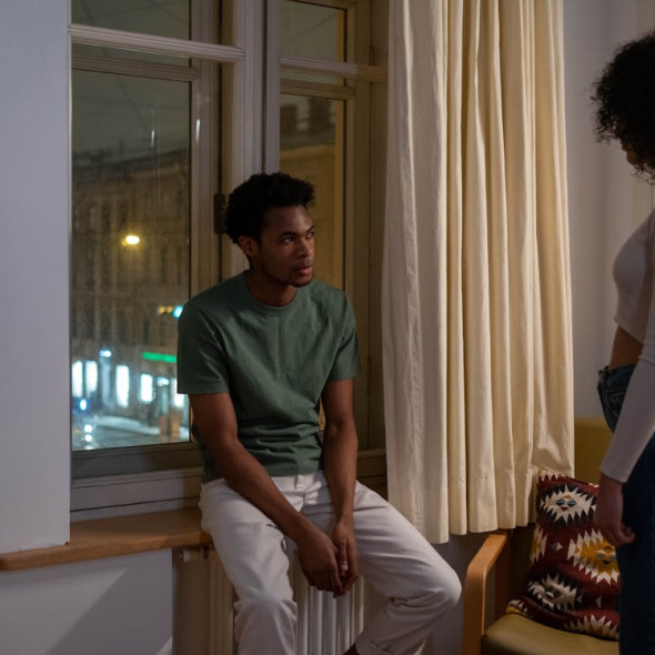 A man and a woman inside an apartment