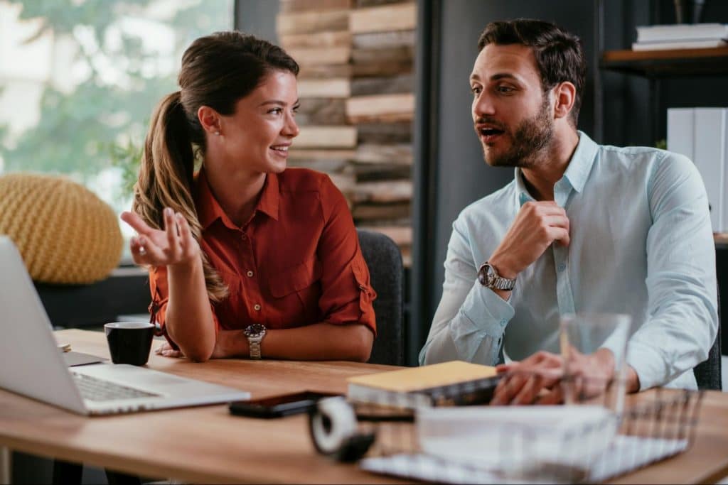 A man and woman talking 