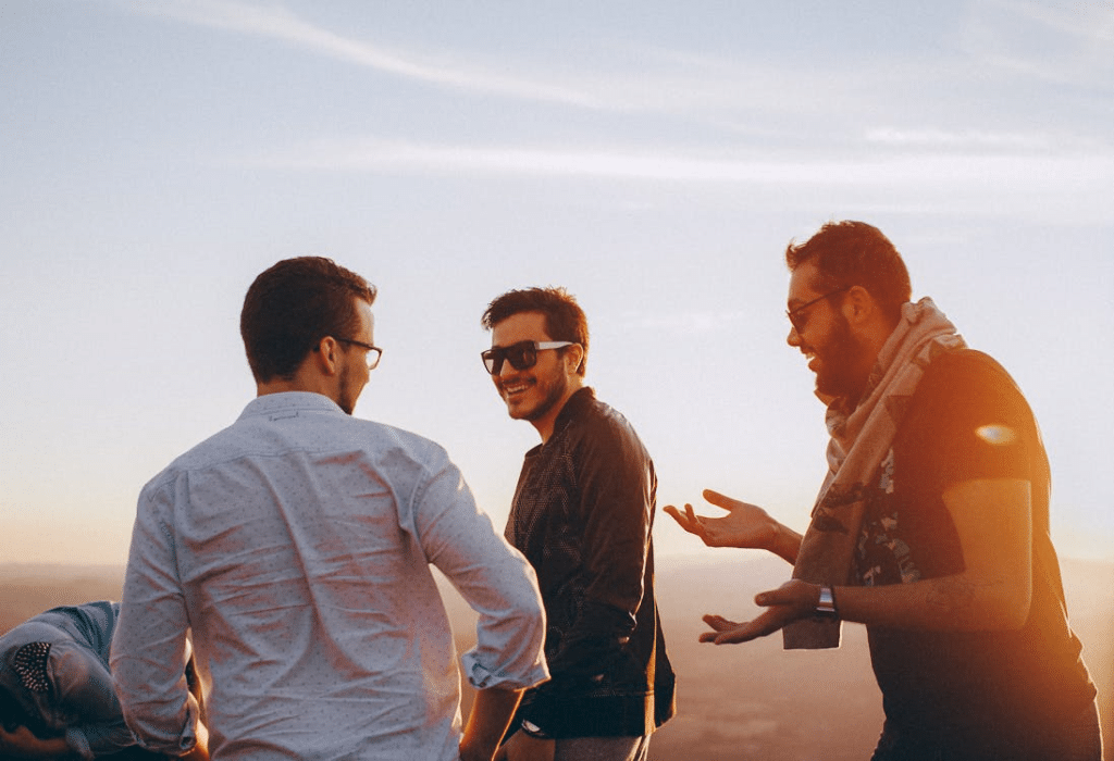 Group of men talking happily