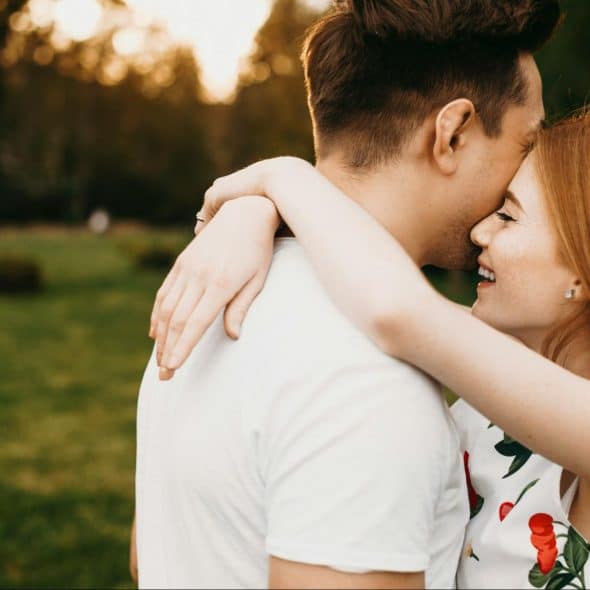 A man and woman embracing each other