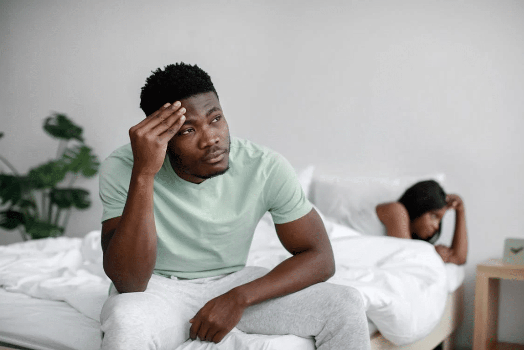A couple arguing in the bed