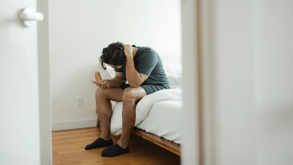 A man looking upset at home