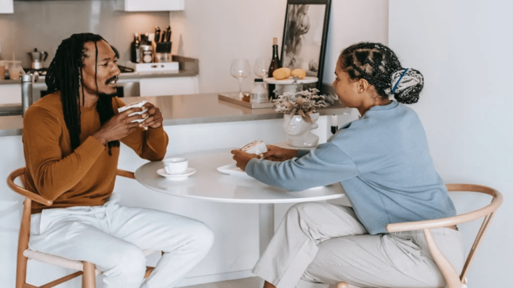 A couple talking in the kitchen