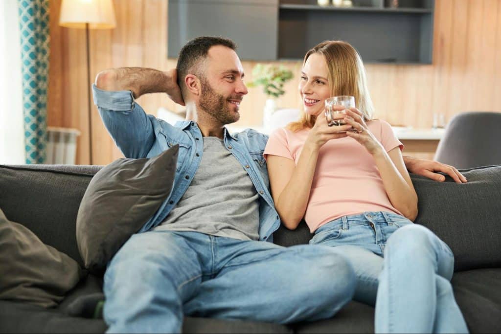 A man and woman at the couch