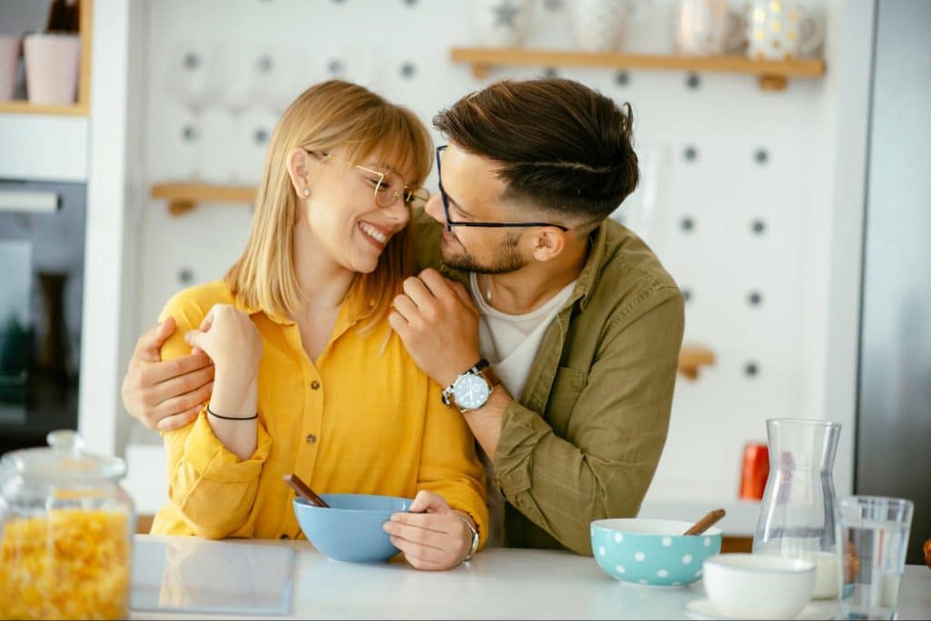 A man and woman smiling at each other