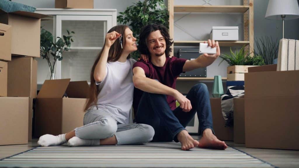 A man and woman sitting at the floor