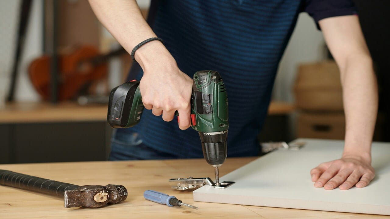 A man assembling a shelf
