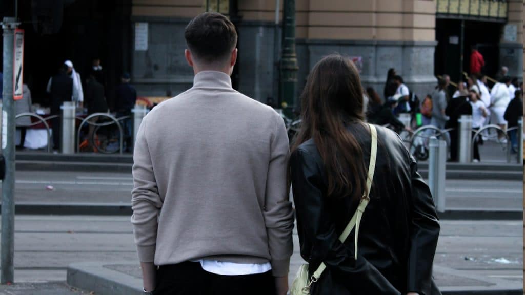 A couple walking on the streets.