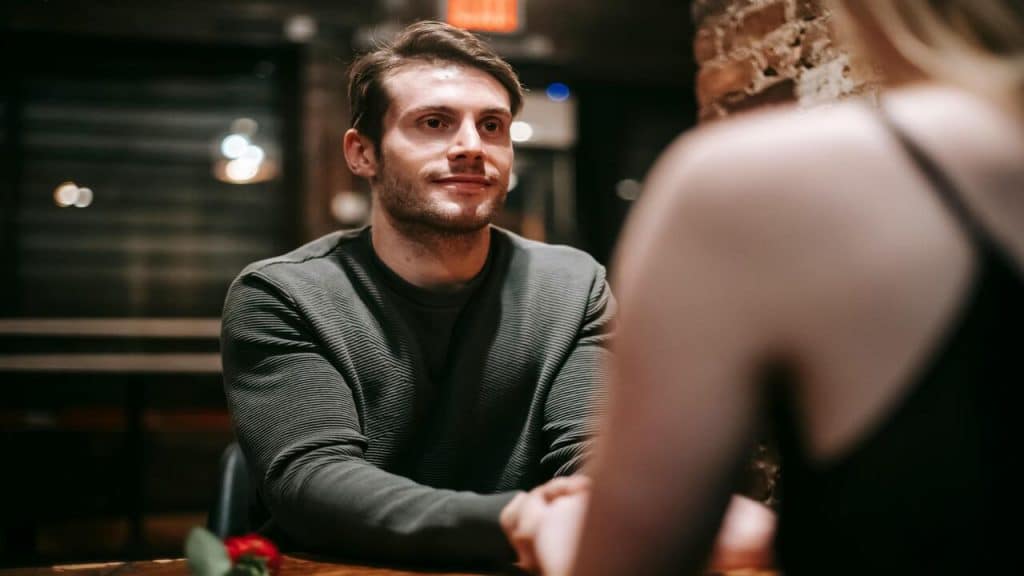 A man listening to his date
