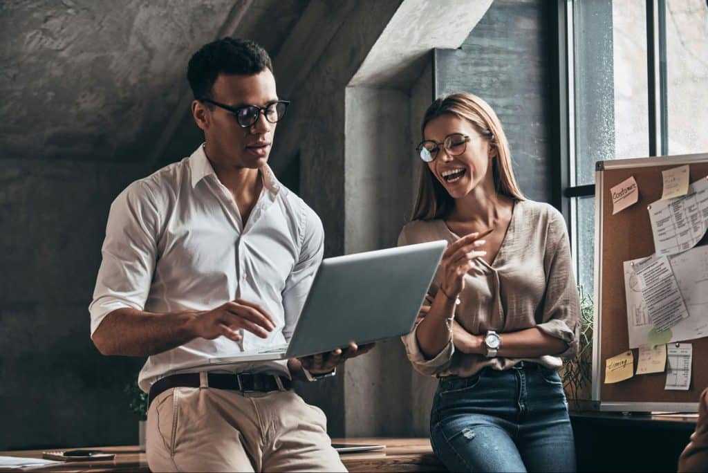 A man holding a laptop