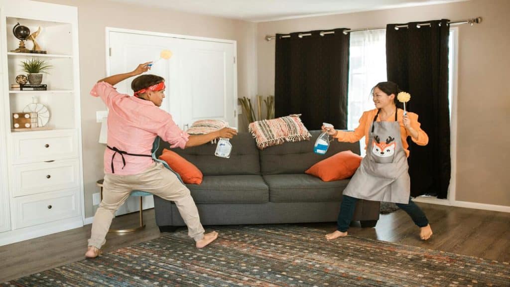 A couple play fighting at home 