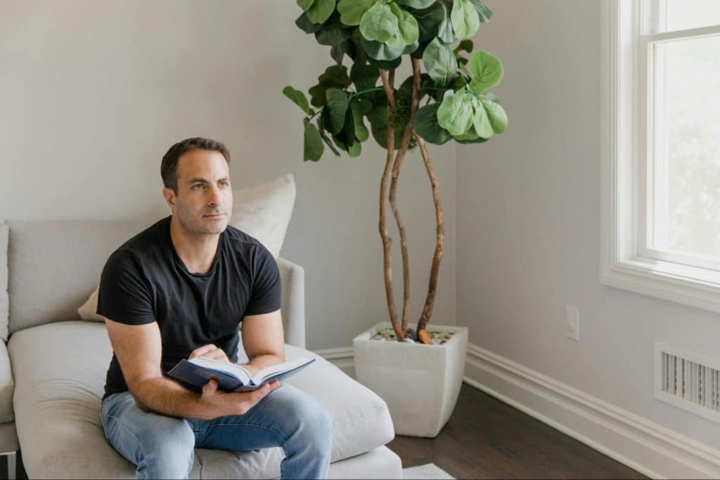 A man holding a book