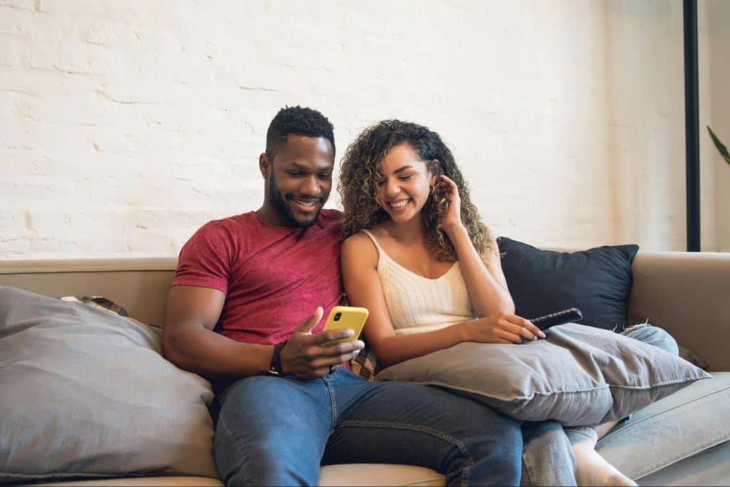 A man and woman at the couch