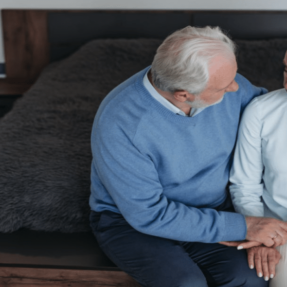 A man comforting his upset wife