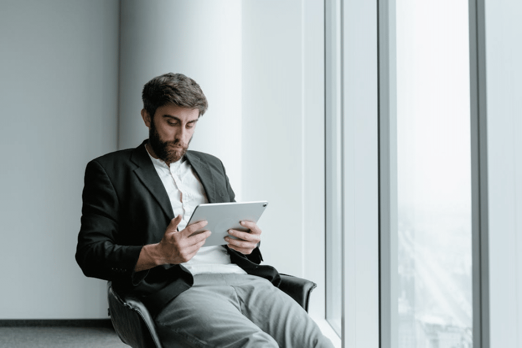 A man holding an ipad