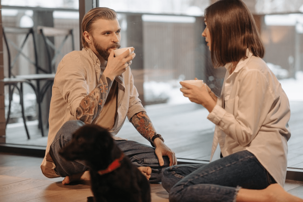 A couple drinking on the floor