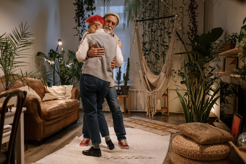 Photograph of an Elderly Couple Dancing in Their Living Room