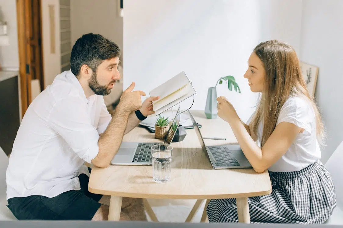 A man and woman talking to each other