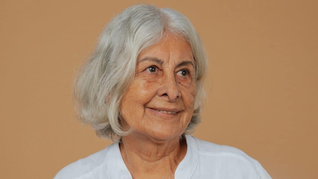 An older woman smiling.