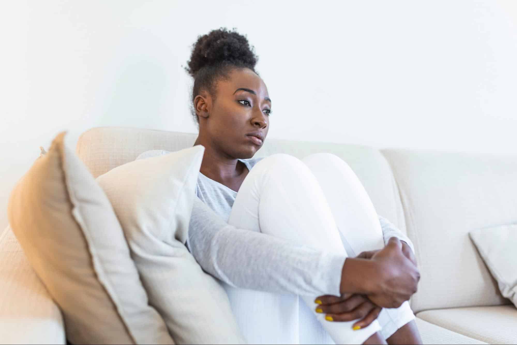 A woman sitting at the sofa
