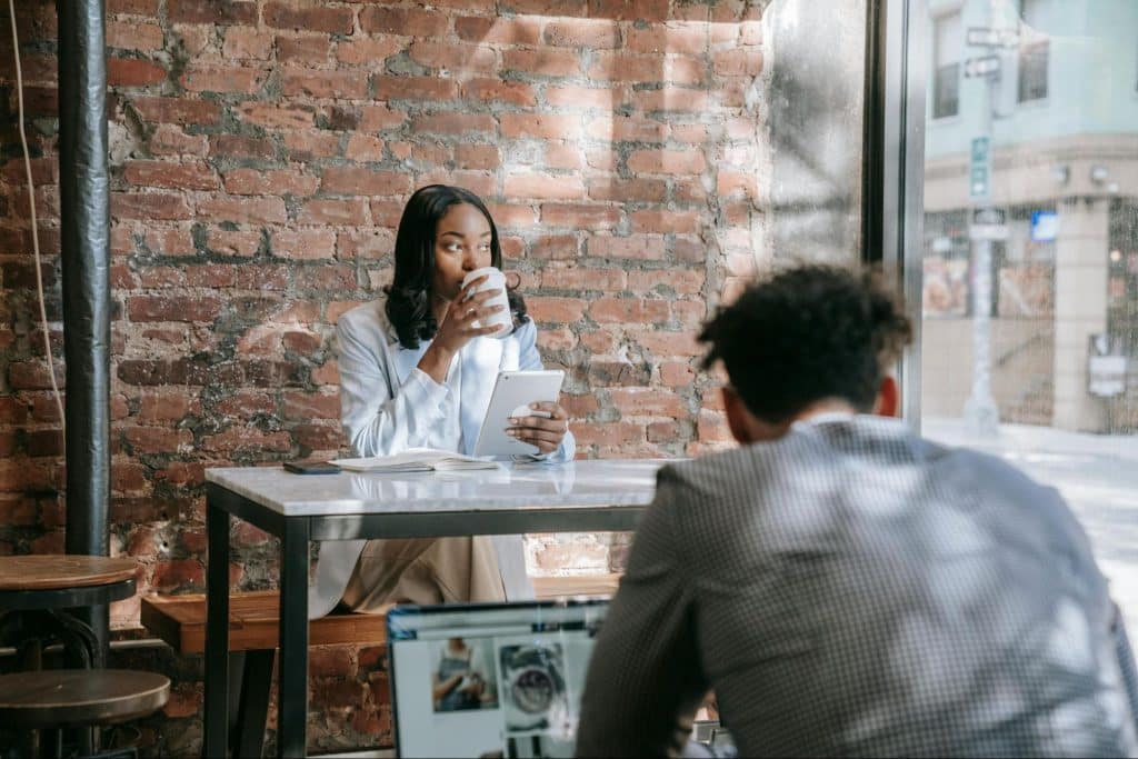 A woman alone and thinking while drinking coffee