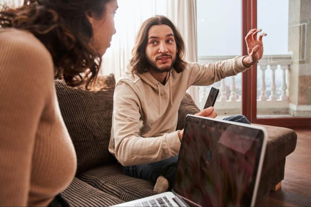 A man explaining something to woman