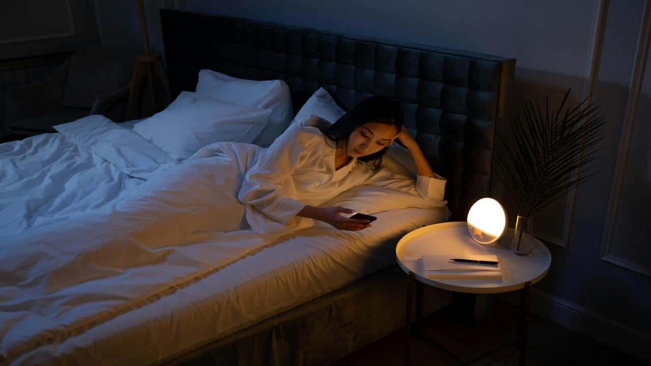 A woman waiting for her husband late at night 