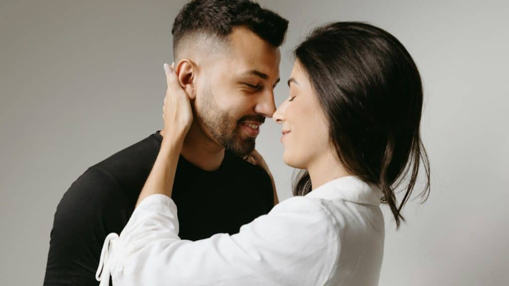 A man and a woman are embracing each other.