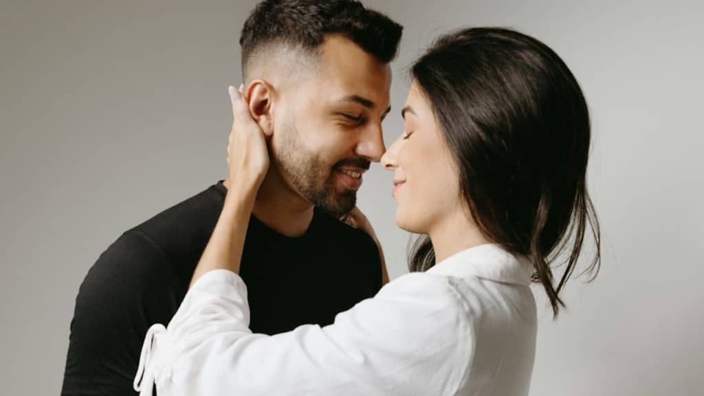 A man and a woman embracing each other.