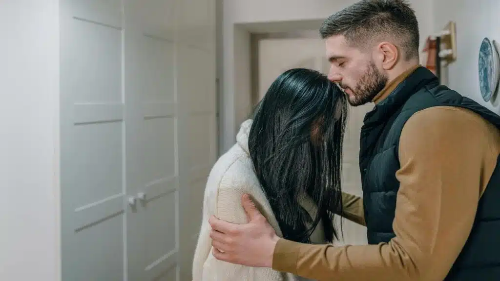 A man calming his wife down