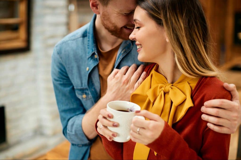 A man hugging a woman