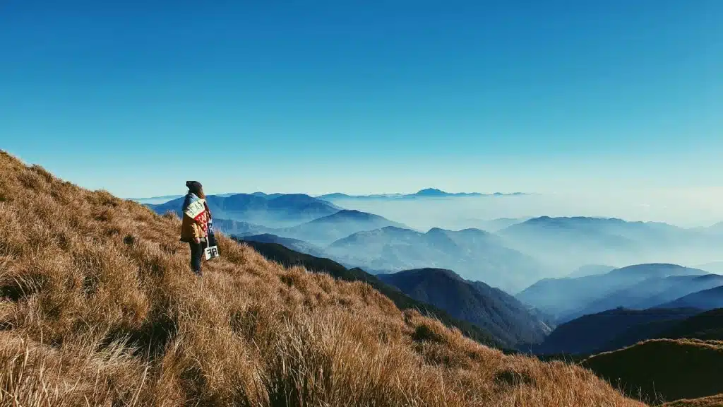 A woman on top of a mountain