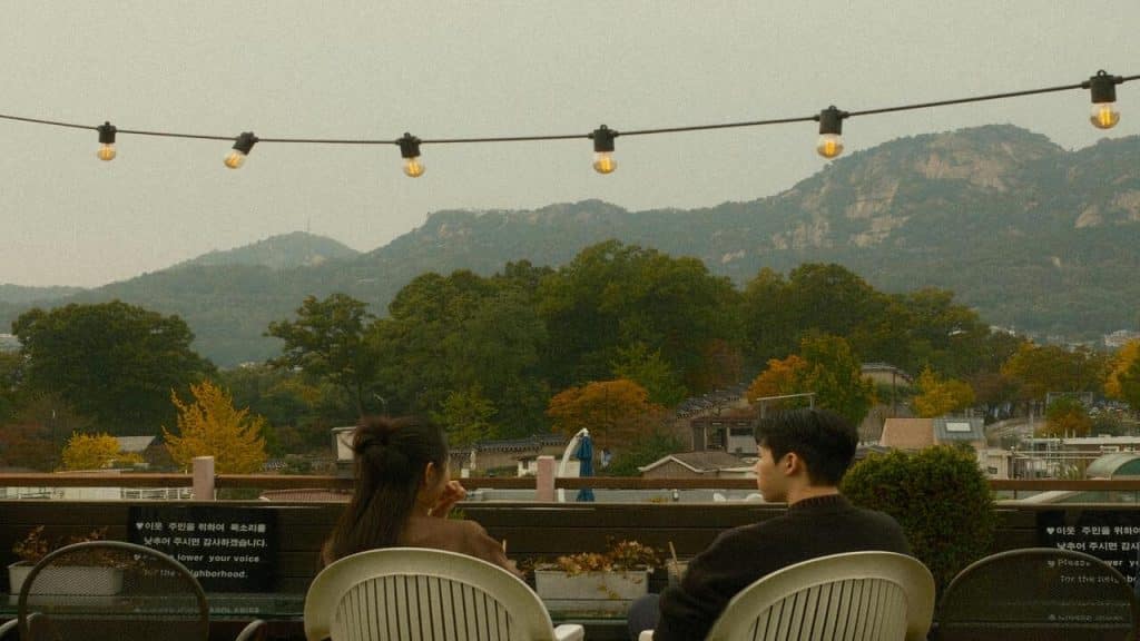 A couple talking at a cafe