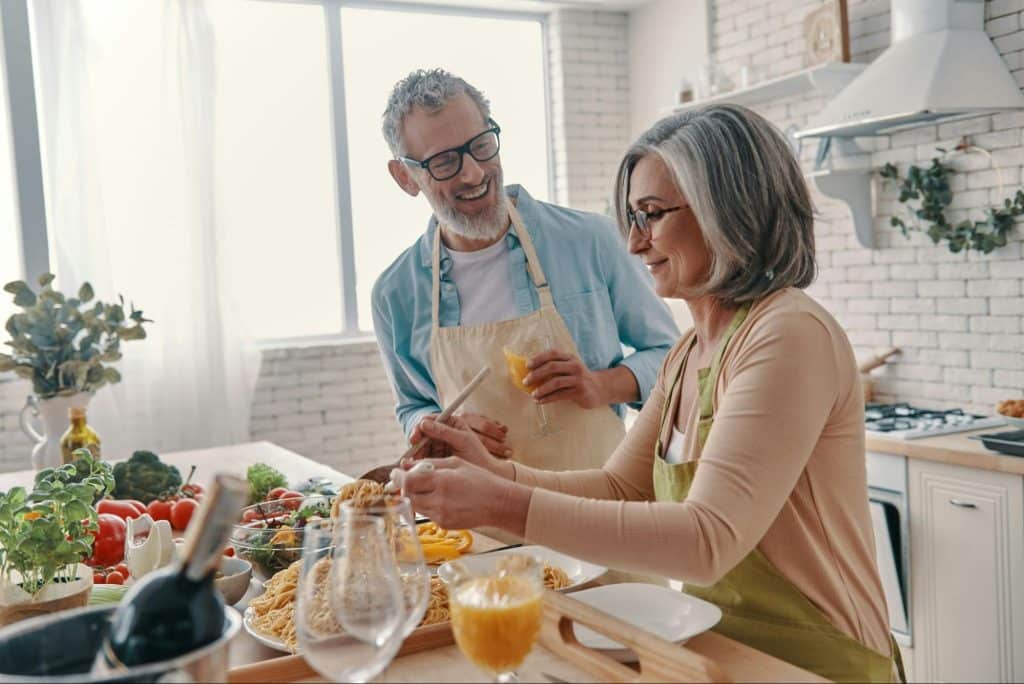 A man and woman at the kitchen
