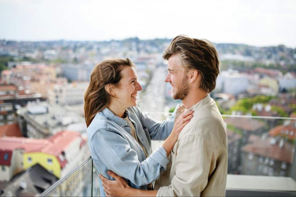 A man and woman smiling at each other