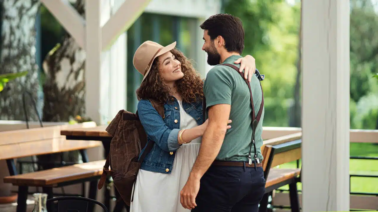 A couple greeting each other at a restaurant