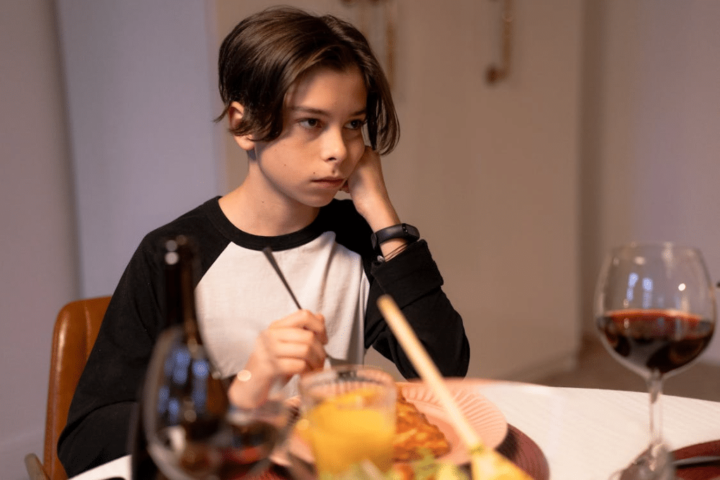 A Sad Boy while Eating