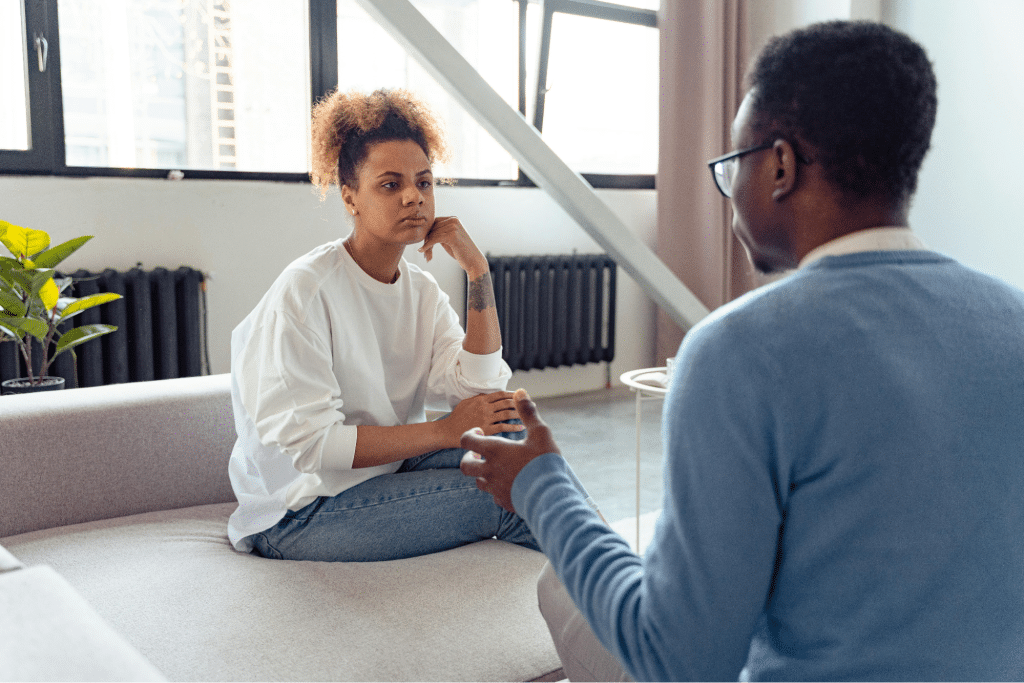 A woman listening to a man