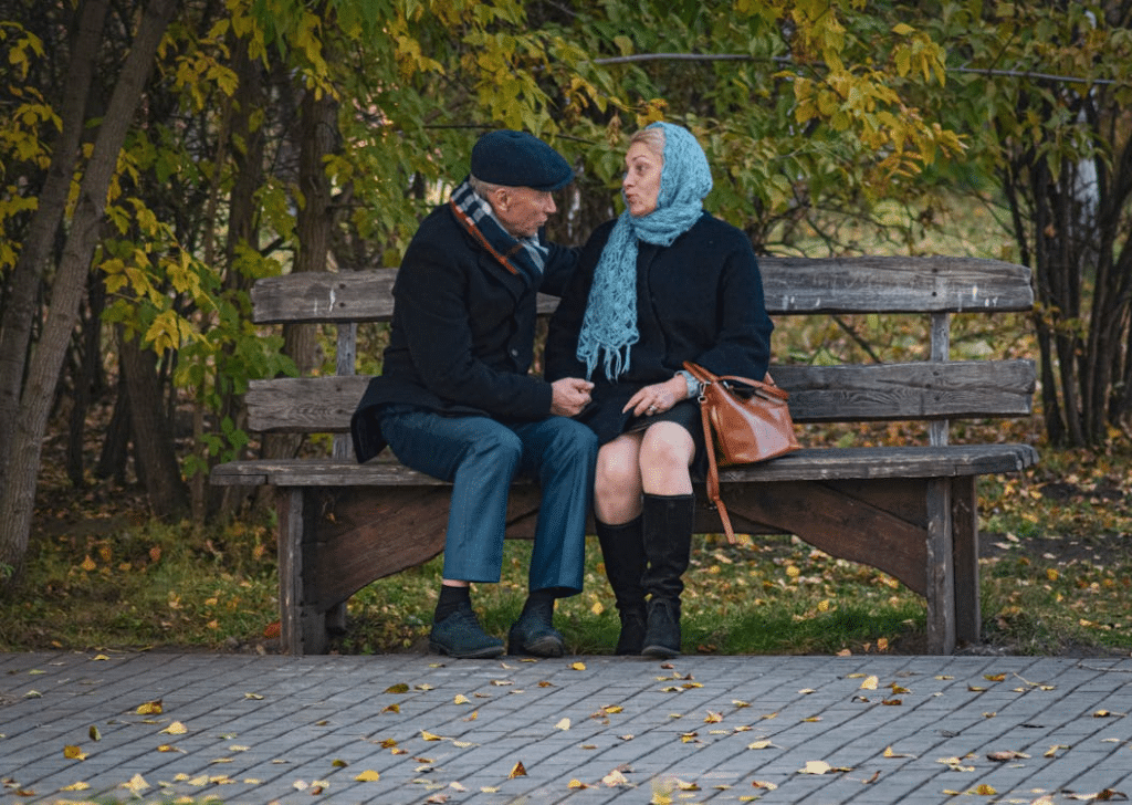A couple sitting on a bench