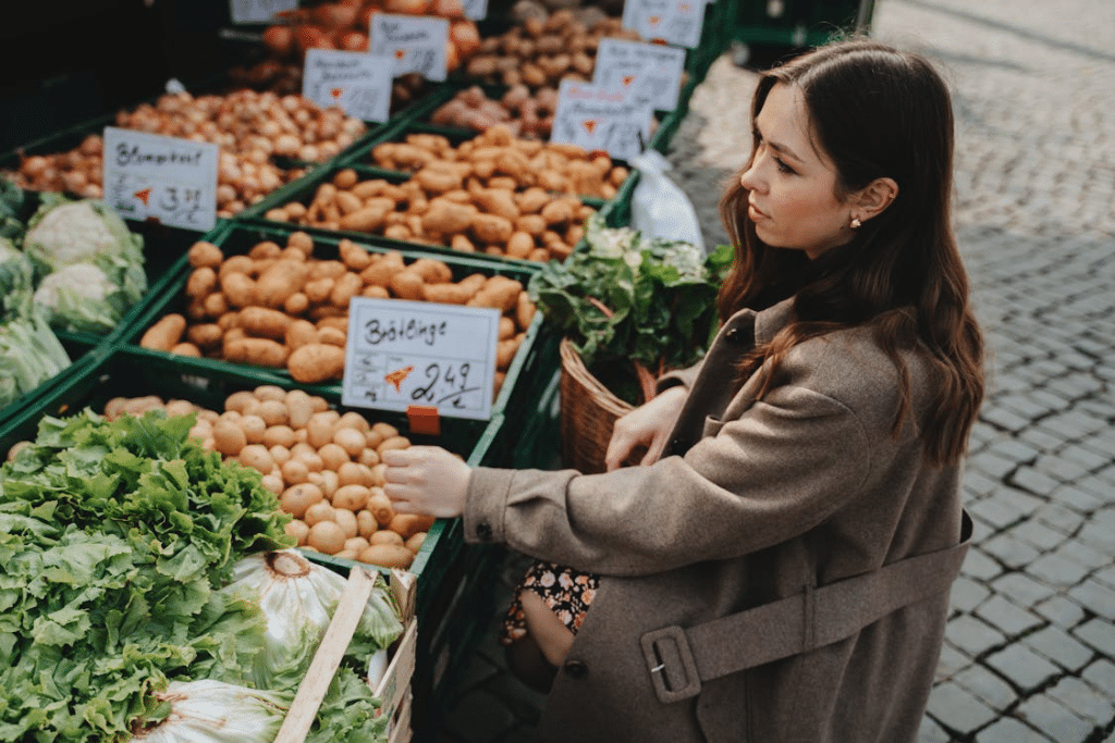 A woman in a brown jacket at the market
