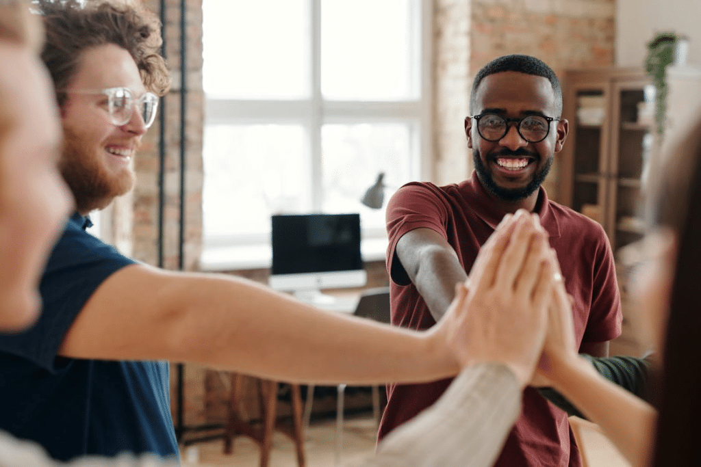 Group of people putting their hands together