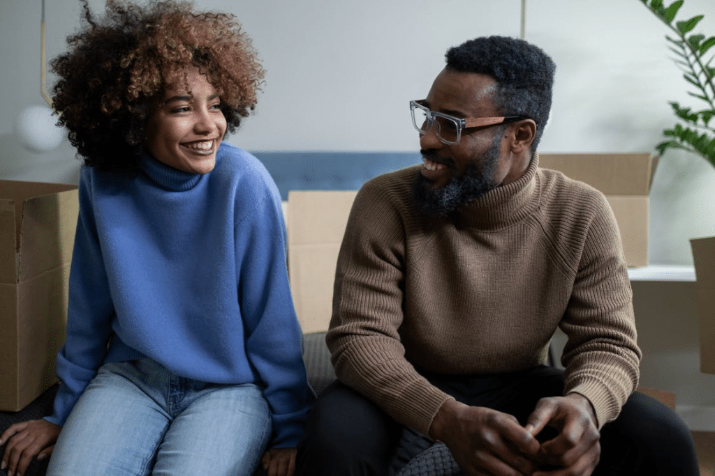 A man and woman smiling